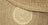 Tapis rond en fibres naturelles torsadées, motif spirale au centre, nuances naturelles