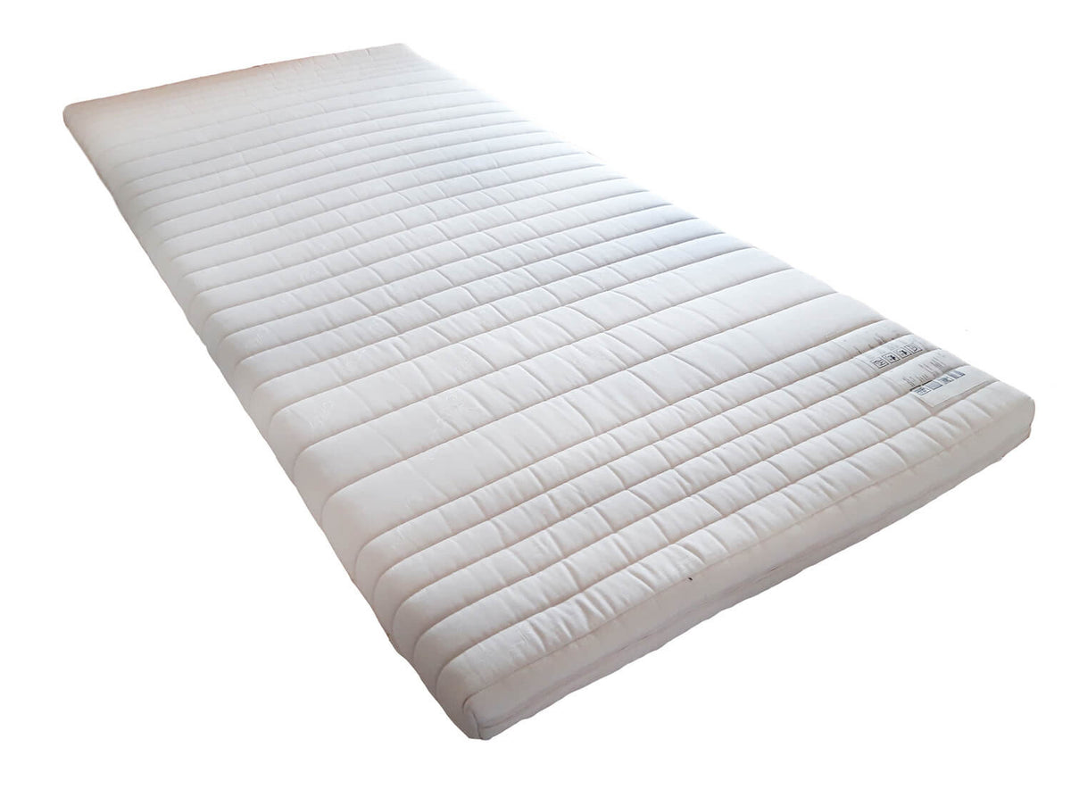 Un surmatelas en latex naturel haut de gamme composé d'une couche de latex et d'un coutil en coton ou laine vierge bio au choix