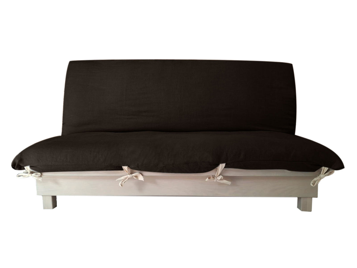 Banquette transformable en lit avec housse noir et base blanche à liens décoratifs, style canapé-lit écologique.