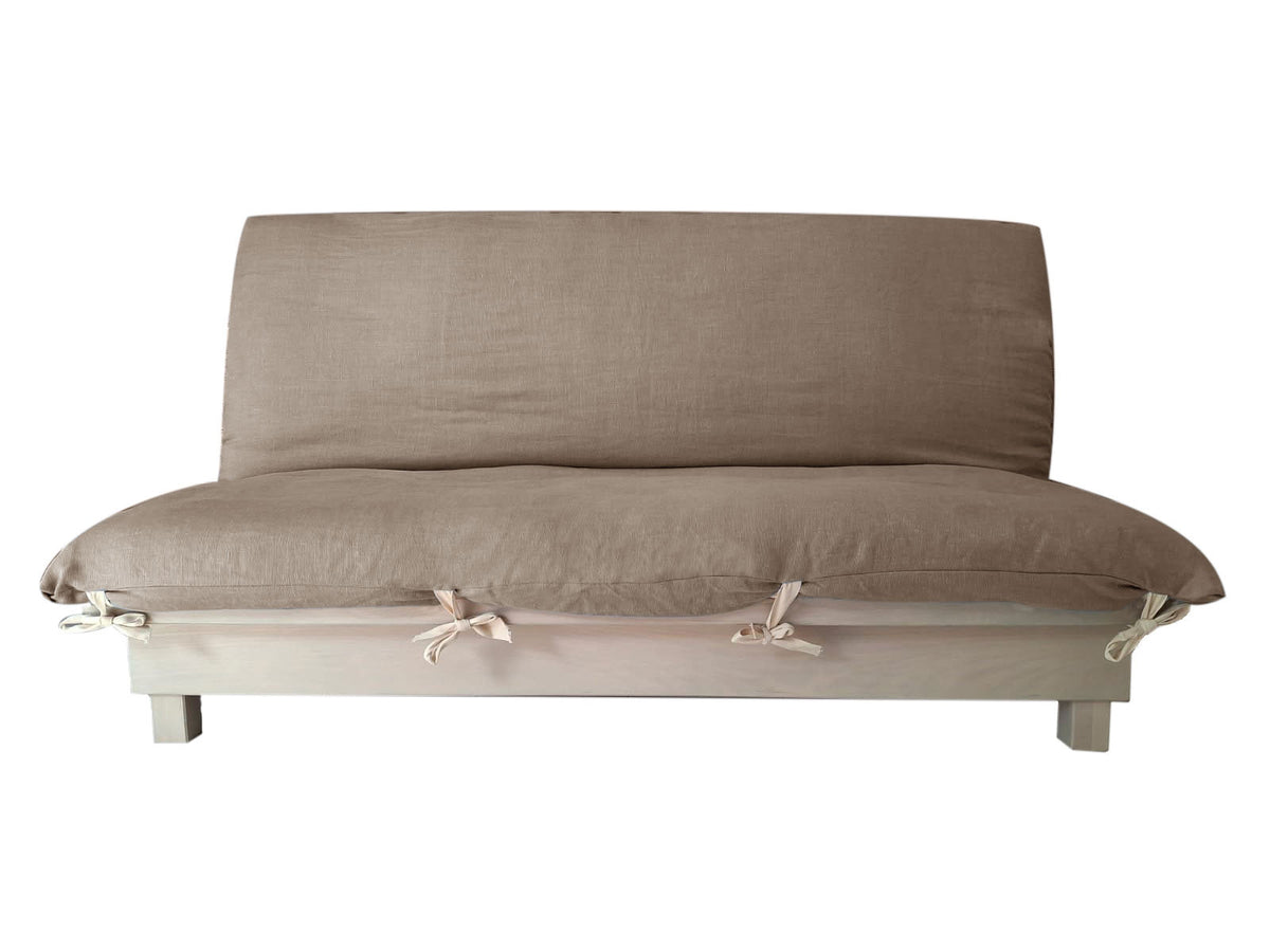 Banquette convertible en lit avec tiroirs de rangement, coussins beige et base en bois clair.
